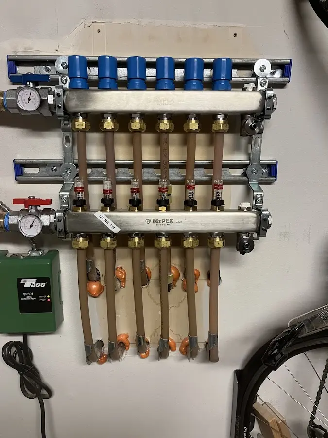 Plumber performing Water Heater Repair at a residential property in Ellery